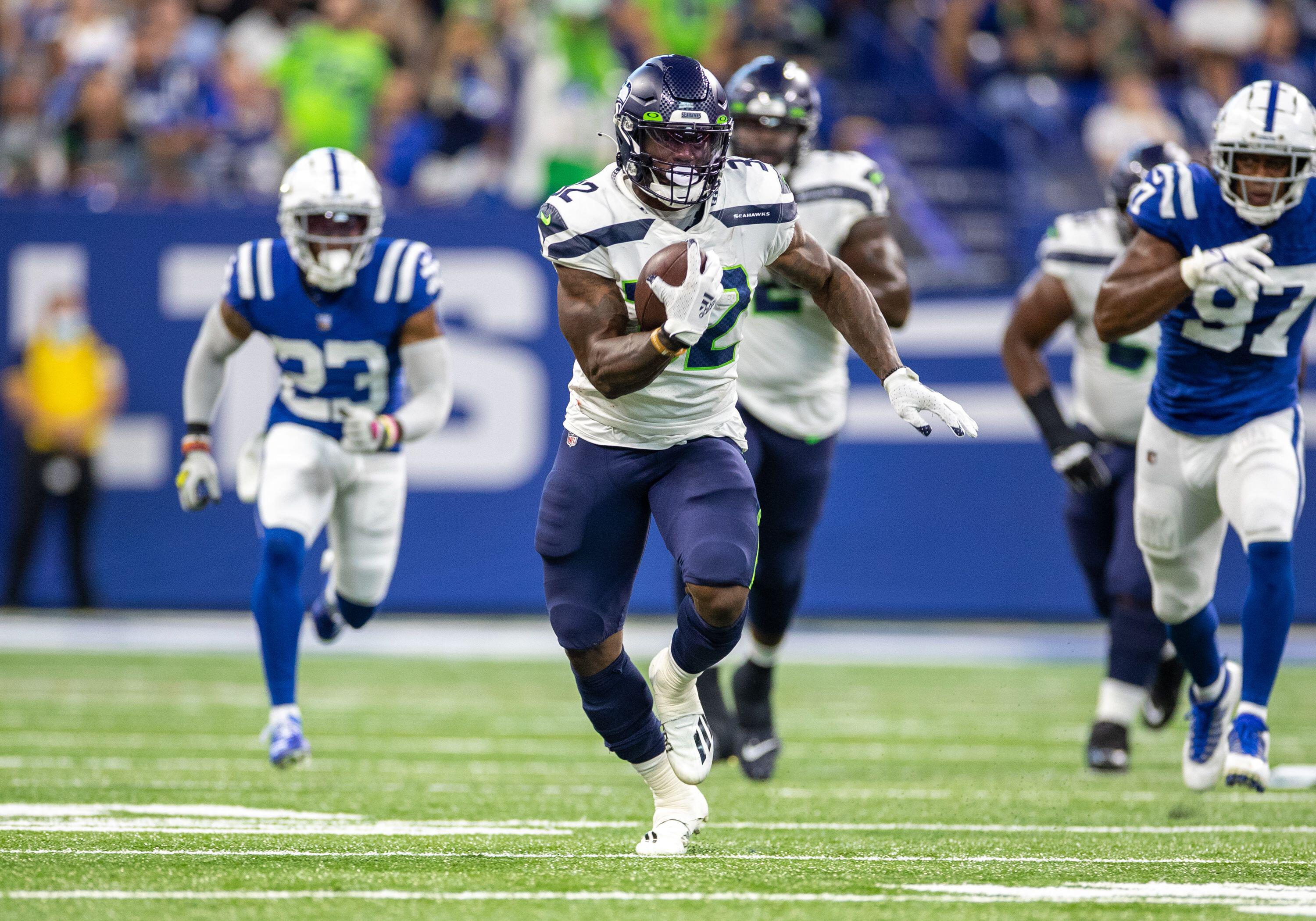Seattle Seahawks running back Chris Carson (32) runs with the ball