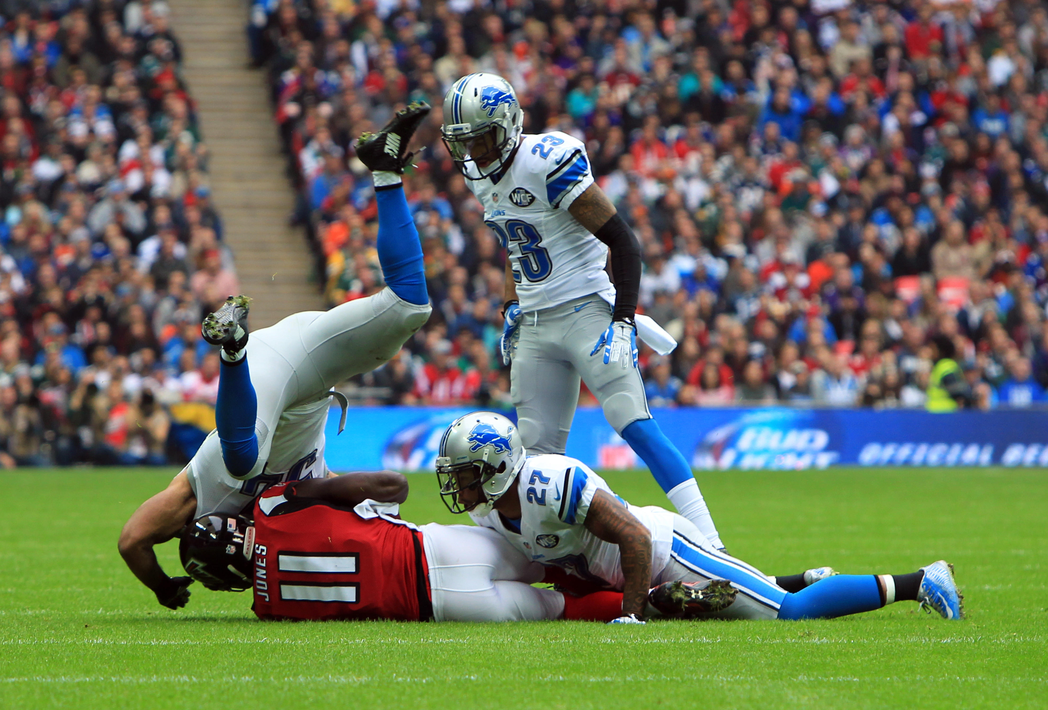 Atlanta Falcons' Julio Jones is tackled by the Detroit Lions